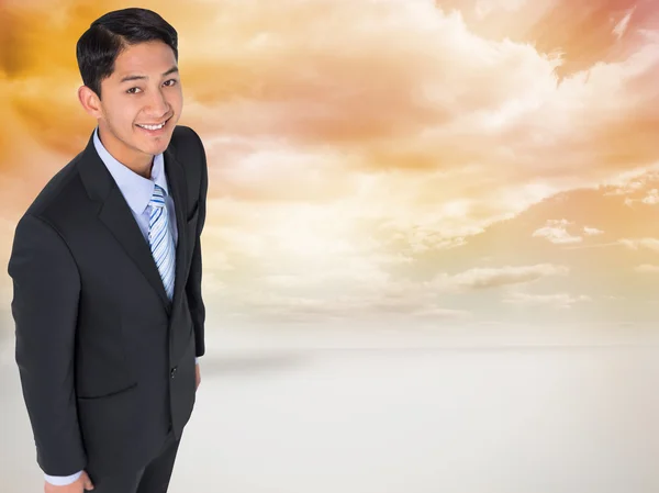 Composite image of smiling asian businessman — Stock Photo, Image