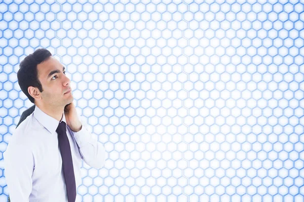 Imagen compuesta del hombre de negocios no sonriente de pie — Foto de Stock