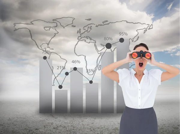 Shocked elegant businesswoman looking through binoculars — Stock Photo, Image