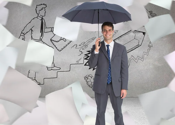 Happy businessman holding grey umbrella — Stock Photo, Image