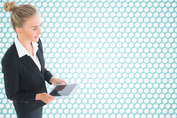 Composite image of businesswoman holding new tablet — Stock Photo, Image