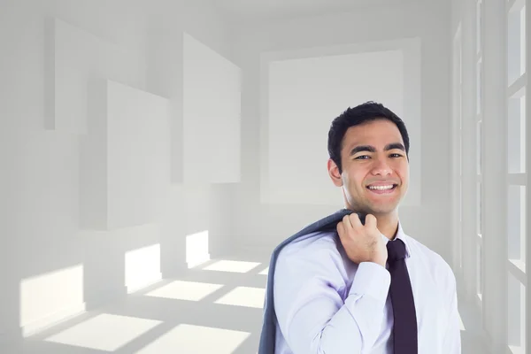 Samengestelde afbeelding van lachende zakenman permanent — Stockfoto
