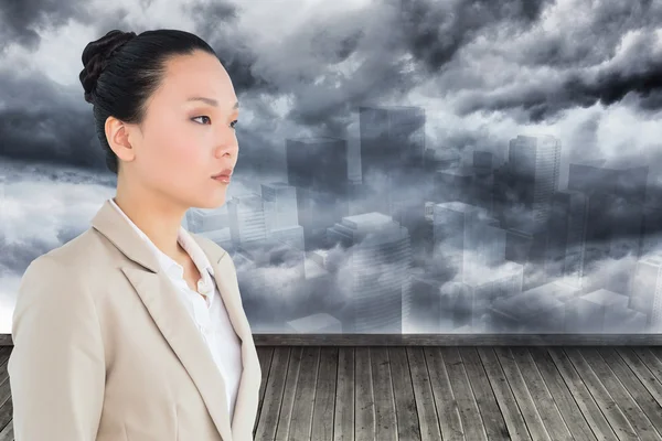 Composite image of unsmiling asian businesswoman — Stock Photo, Image