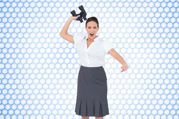 Angry businesswoman throwing binoculars away — Stock Photo, Image