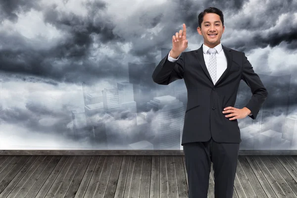 Image composite de souriant asiatique homme d'affaires pointant — Photo