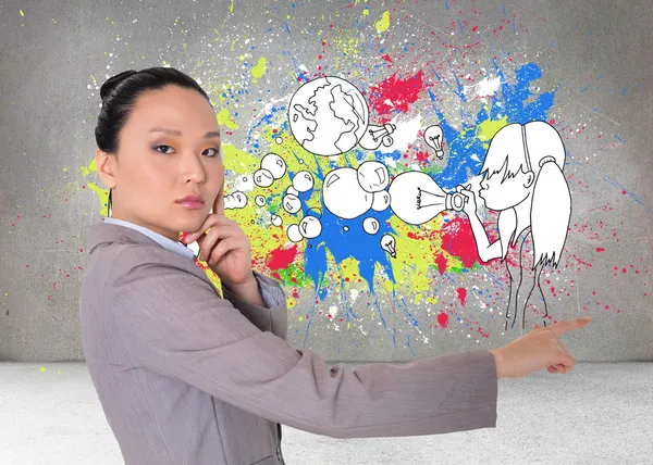 Composite image of thoughtful asian businesswoman pointing — Stock Photo, Image