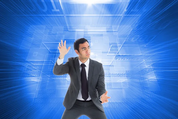 Composite image of unsmiling businessman catching — Stock Photo, Image