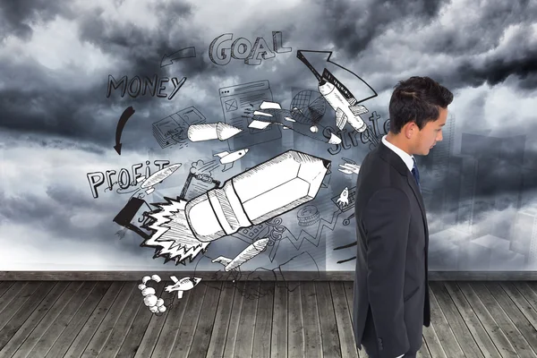 Composite image of unsmiling businessman looking down — Stock Photo, Image