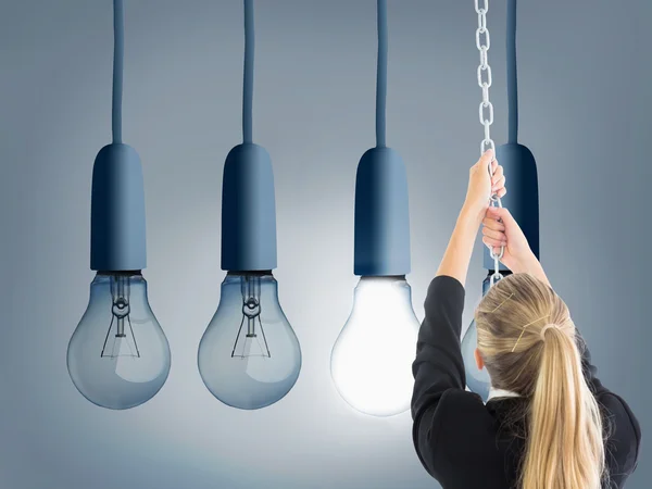 Composite image of businesswoman pulling a chain — Stock Photo, Image