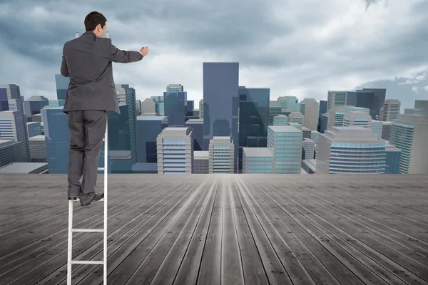 Composite image of businessman standing on ladder — Stock Photo, Image