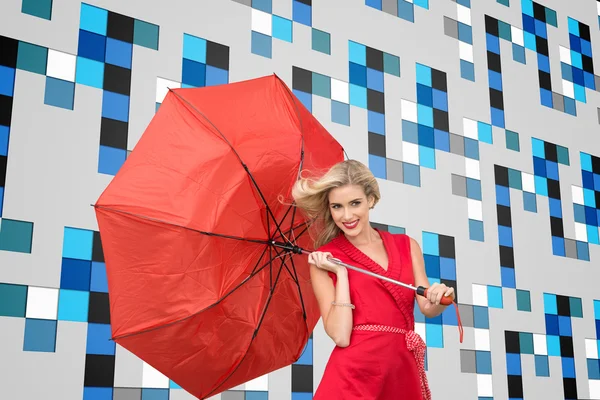 Imagem composta de sorriso loira segurando guarda-chuva — Fotografia de Stock