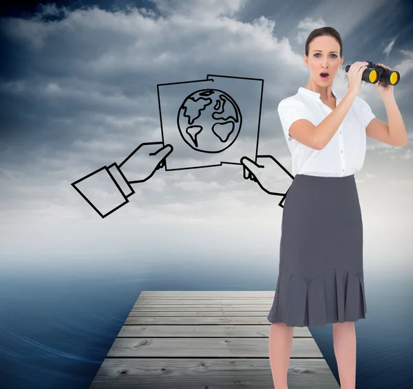 Astonished elegant businesswoman holding binoculars — Stock Photo, Image