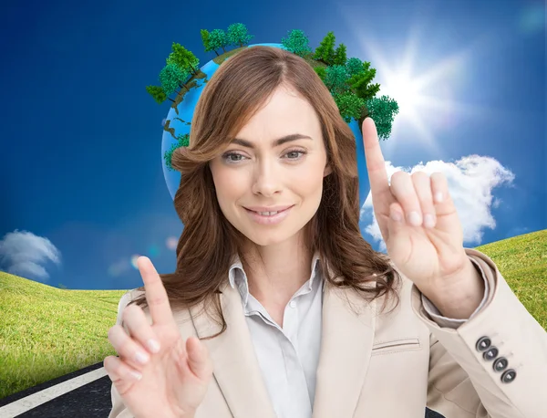 Businesswoman touching invisible screen — Stock Photo, Image