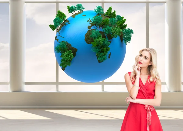 Thoughtful blonde wearing red dress — Stock Photo, Image