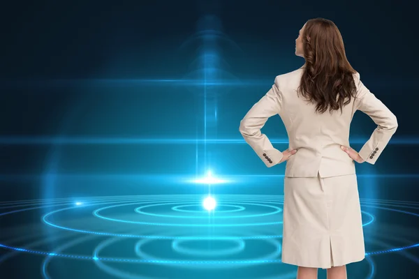 Composite image of businesswoman standing back to camera — Stock Photo, Image