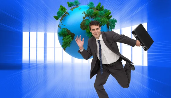 Cheerful attractive businessman in a hury — Stock Photo, Image