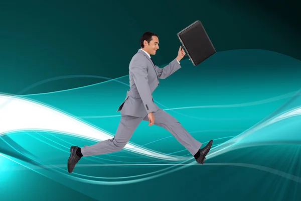 Businessman running with a suitcase — Stock Photo, Image