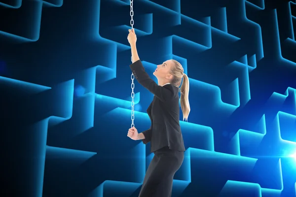 Composite image of businesswoman pulling a chain — Stock Photo, Image