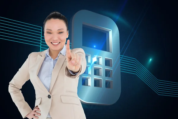 Composite image of smiling asian businesswoman pointing Stock Image