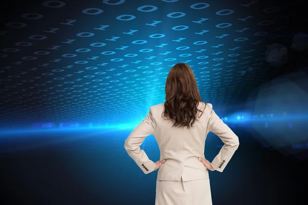 Composite image of businesswoman standing back to camera — Stock Photo, Image