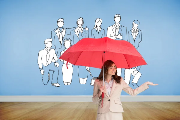 Composite image of attractive businesswoman holding red umbrella — Stock Photo, Image