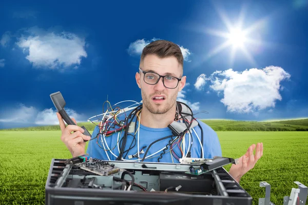 Confused it professional with cables and phone — Stock Photo, Image