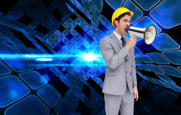 Young architect yelling with a megaphone — Stock Photo, Image