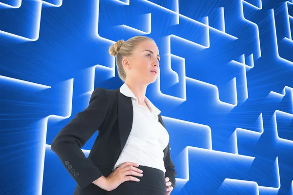 Composite image of businesswoman standing with hands on hips — Stock Photo, Image