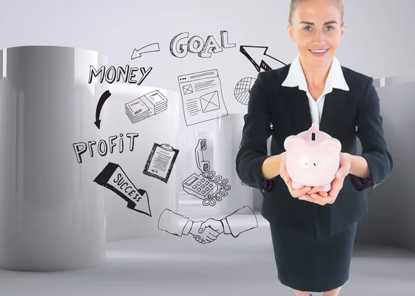 Složený obraz podnikatelka drží růžové prasátko — Stock fotografie