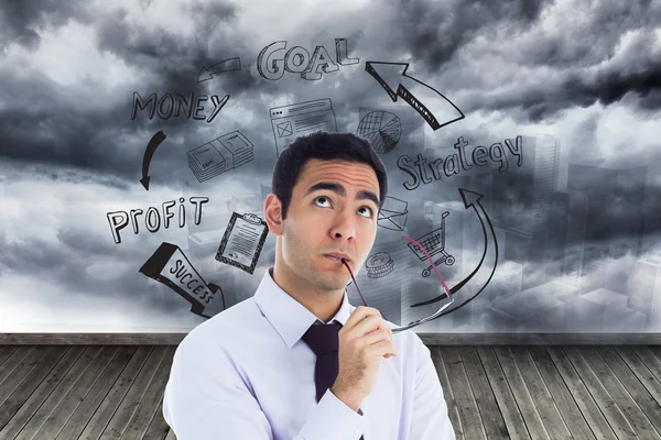 Composite image of thinking businessman holding glasses — Stock Photo, Image