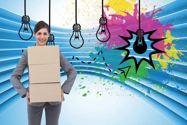 Composite image of smiling businesswoman carrying cardboard boxes — Stock Photo, Image