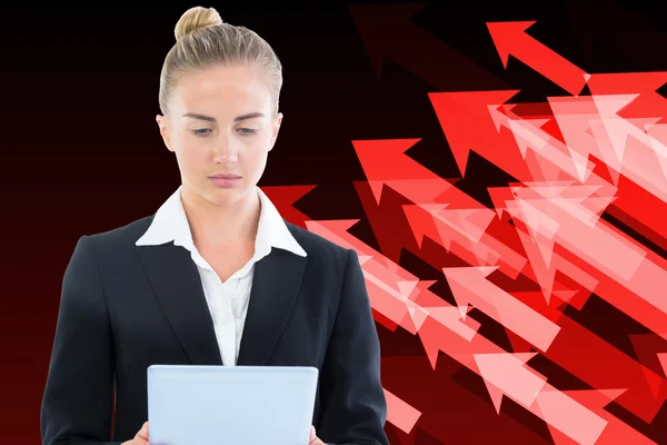 Composite image of businesswoman holding tablet — Stock Photo, Image