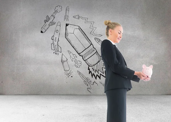 Composite image of businesswoman holding pink piggy bank — Stock Photo, Image