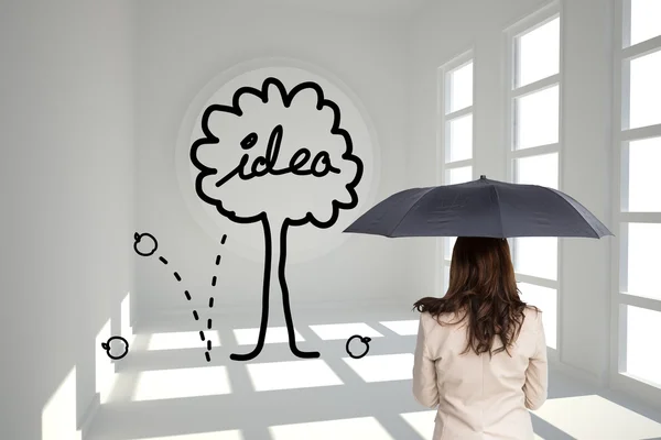 Composite image of rear view of classy businesswoman holding umbrella — Stock Photo, Image