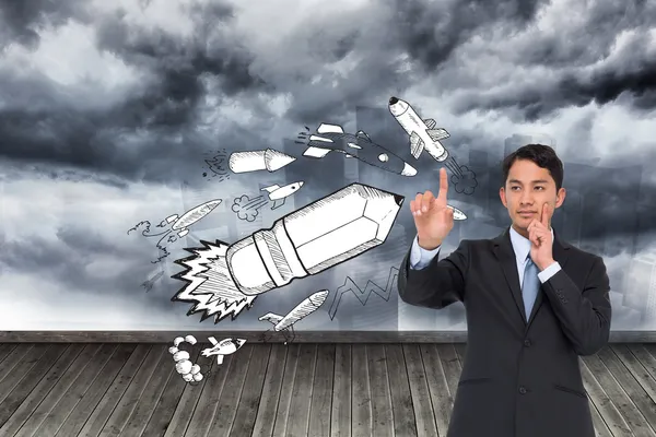 Composite image of thoughtful asian businessman pointing — Stock Photo, Image