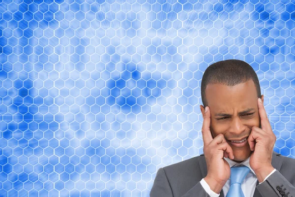 Composite image of stressed businessman putting his fingers on h — Stock Photo, Image