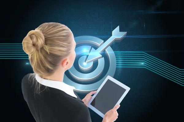 Composite image of businesswoman holding tablet — Stock Photo, Image