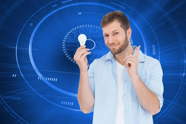 Model holding a bulb in right hand — Stockfoto