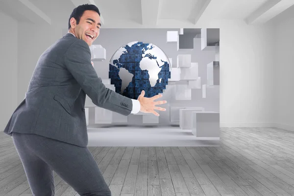Composite image of excited businessman catching — Stock Photo, Image