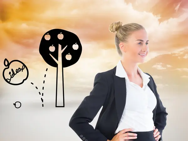 Composite image of businesswoman standing with hands on hips — Stock Photo, Image