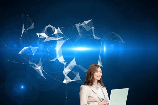 Smiling businesswoman sitting and using laptop — Stock Photo, Image