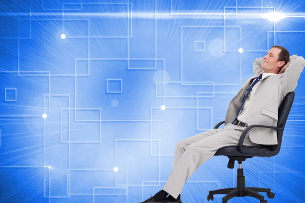 Businessman leaning back in his chair — Stock Photo, Image