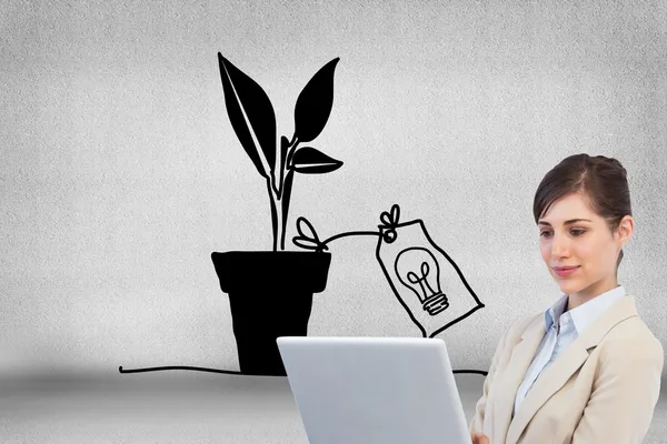 Confident businesswoman holding laptop — Stock Photo, Image