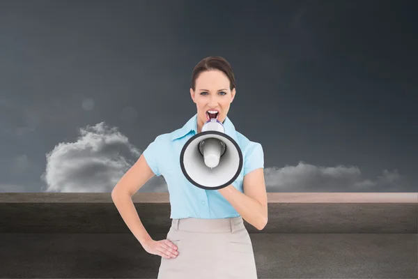 Composite image of furious classy businesswoman talking in megaphone — Stock Photo, Image