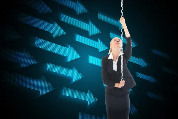 Composite image of businesswoman pulling a chain — Stock Photo, Image