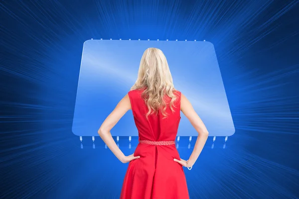 Composite image of elegant blonde standing hands on hips — Stock Photo, Image