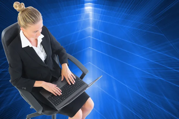 Composite image of businesswoman sitting on swivel chair — Stock Photo, Image