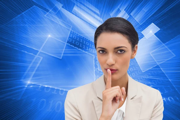 Composite image of young businesswoman asking for silence — Stock Photo, Image