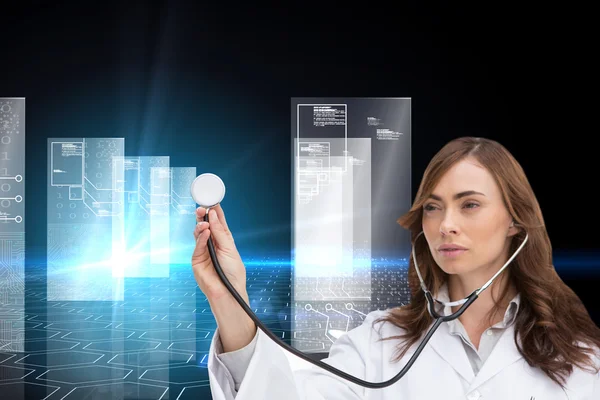 Composite image of thoughtful doctor using stethoscope — Stock Photo, Image