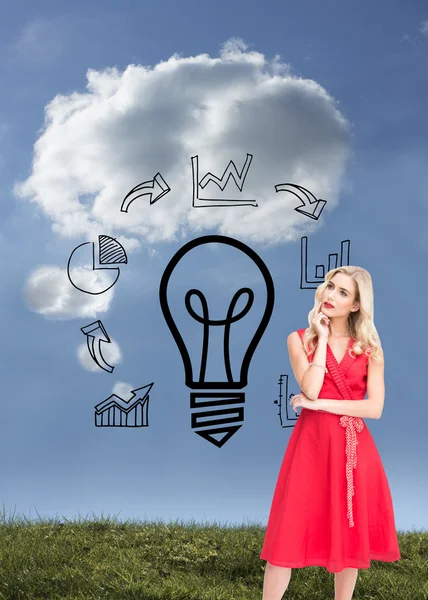 Thoughtful blonde wearing red dress — Stock Photo, Image